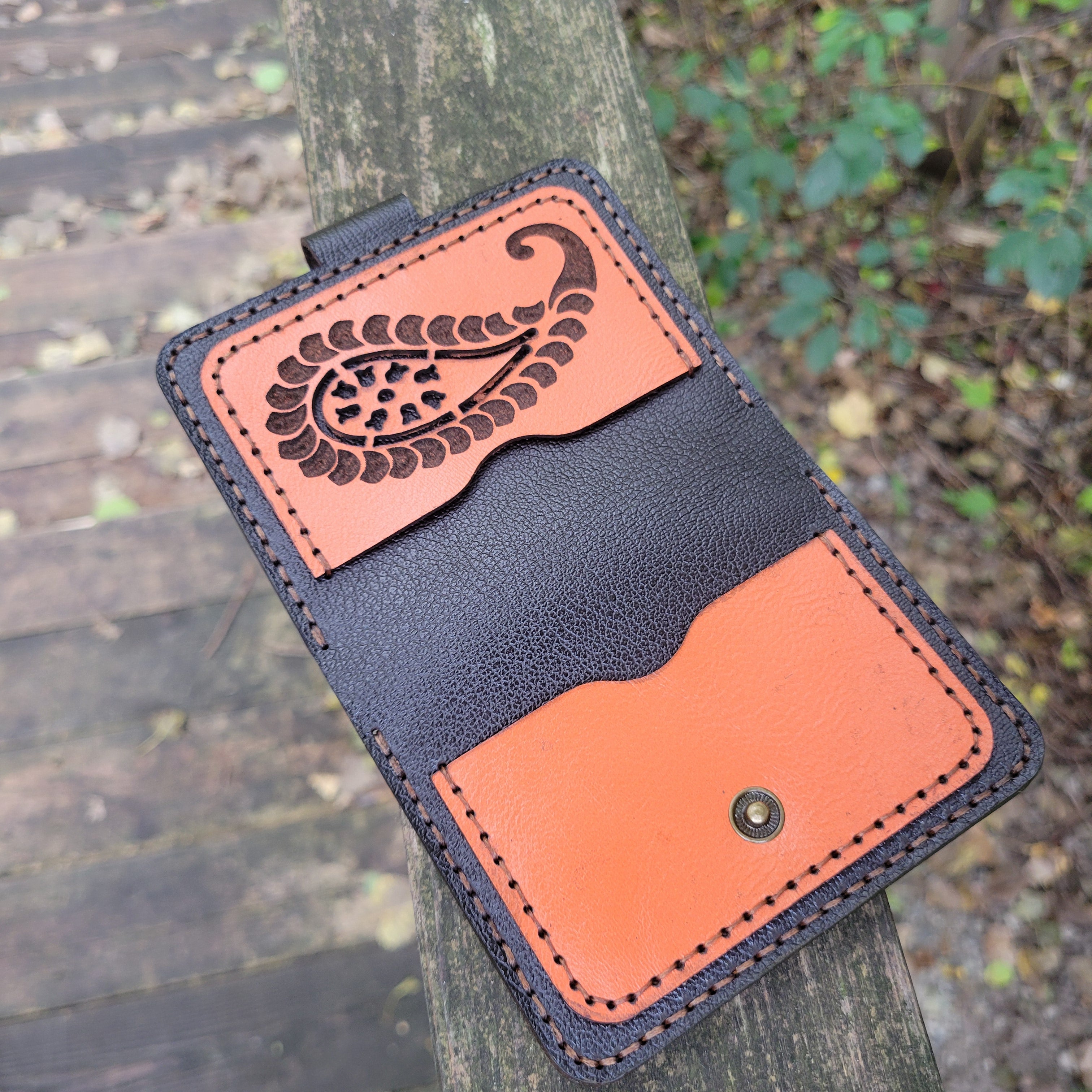 Leather wallet with 6 card slots and 2 pockets, handcrafted in Canada with a secure snap closure for essentials.