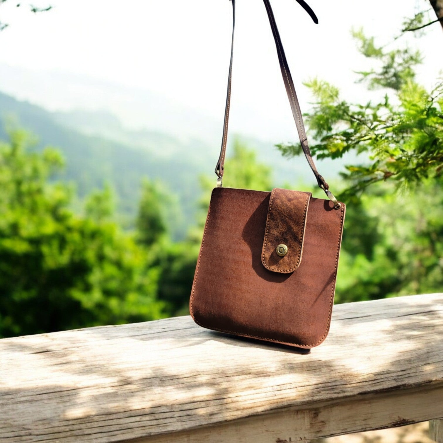 Minimalist tan leather bag with adjustable strap, secure closure, and lightweight design for everyday use.