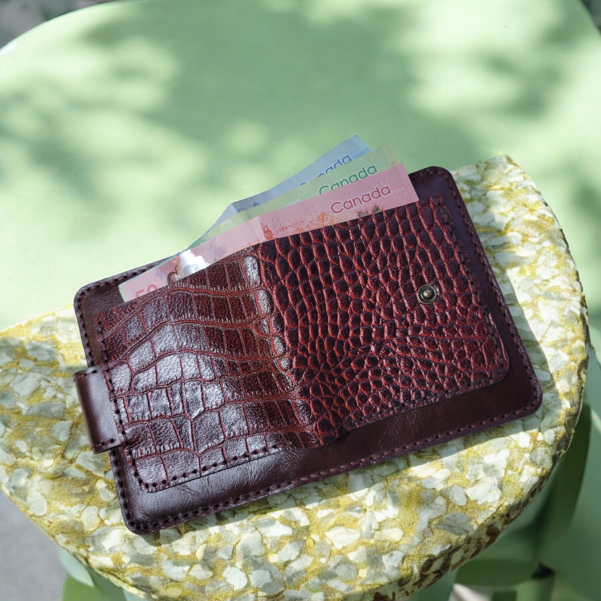 Compact wallet in premium natural leather with a rich, crocodile-embossed finish.