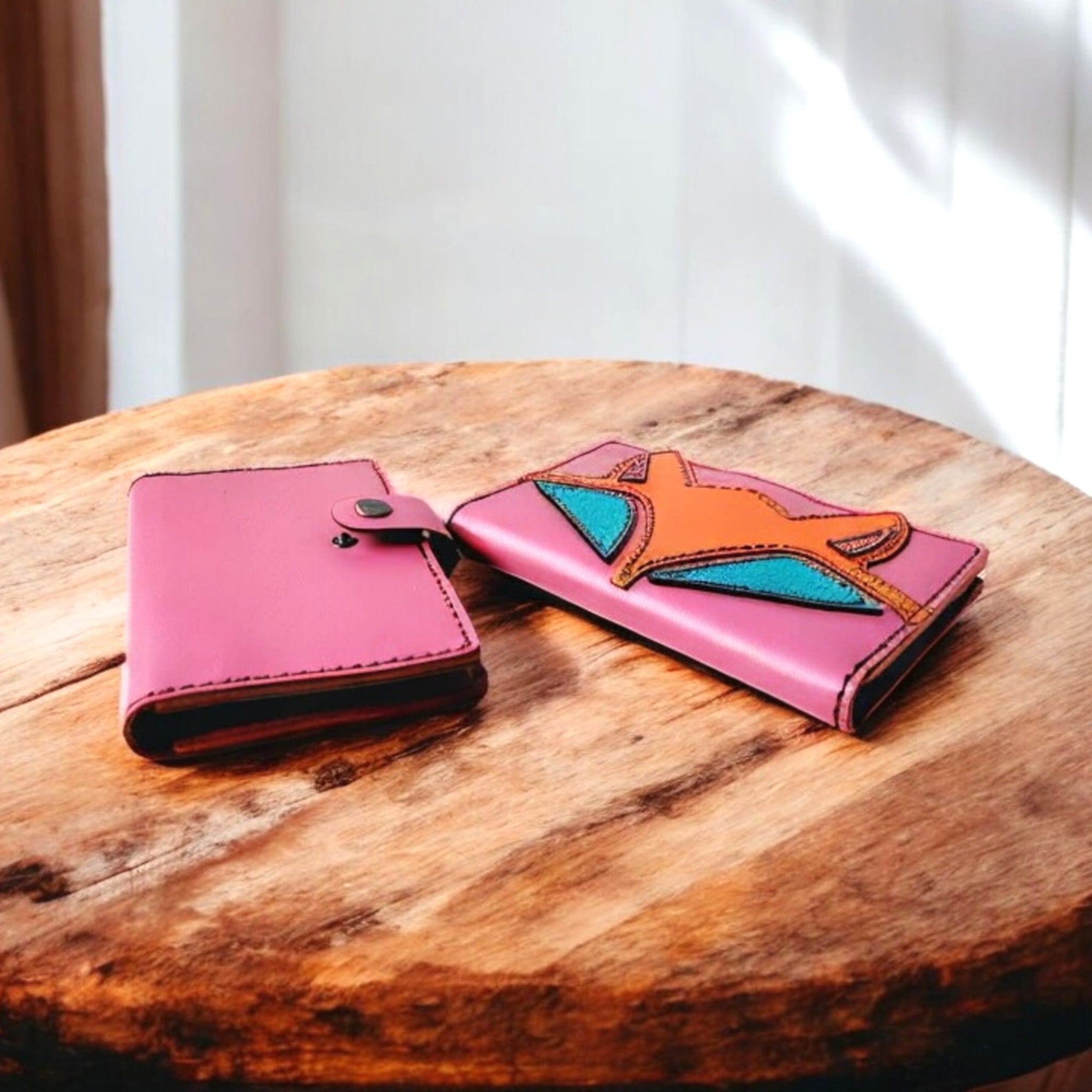 A handcrafted leather wallet with a cute fox design, displayed open to show multiple card slots, a zippered compartment, and a transparent ID slot.