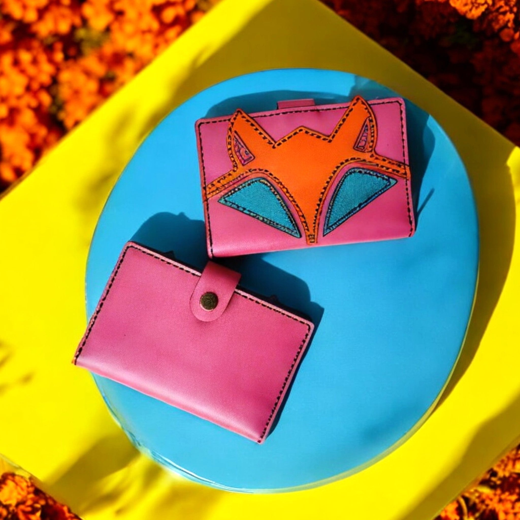 A handcrafted leather wallet with a cute fox design, displayed open to show multiple card slots, a zippered compartment, and a transparent ID slot.