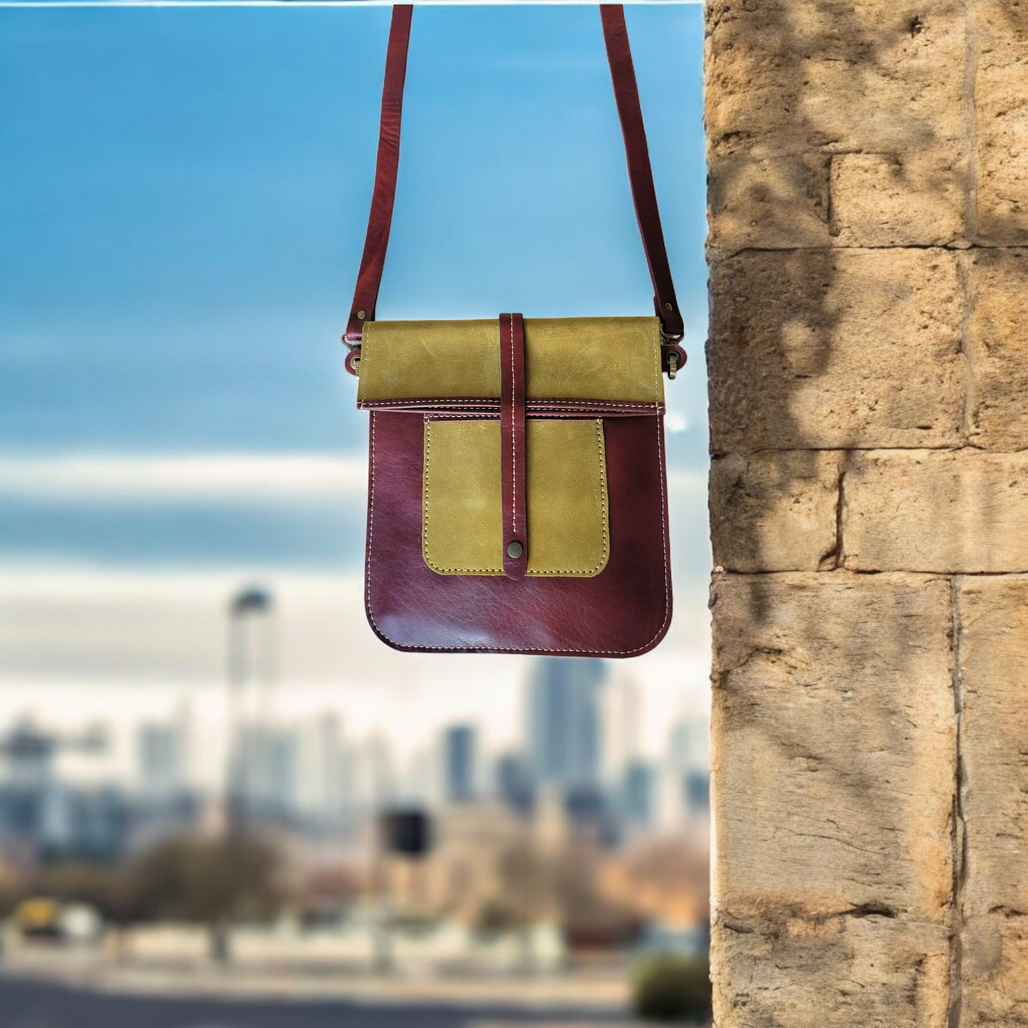 Full-grain olive and crimson leather crossbody with adjustable strap