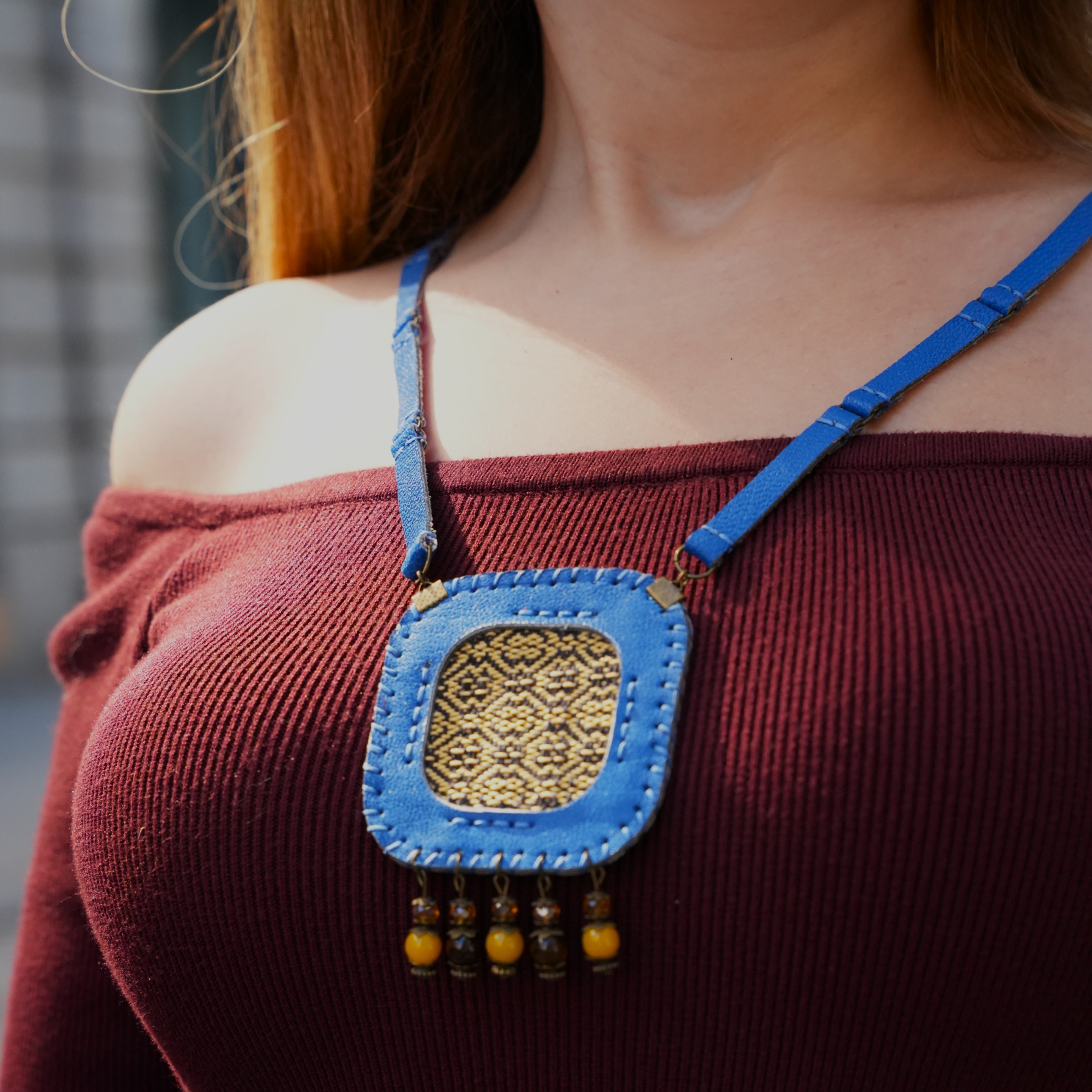 Artisan crescent pendant symbolizing balance and emotion