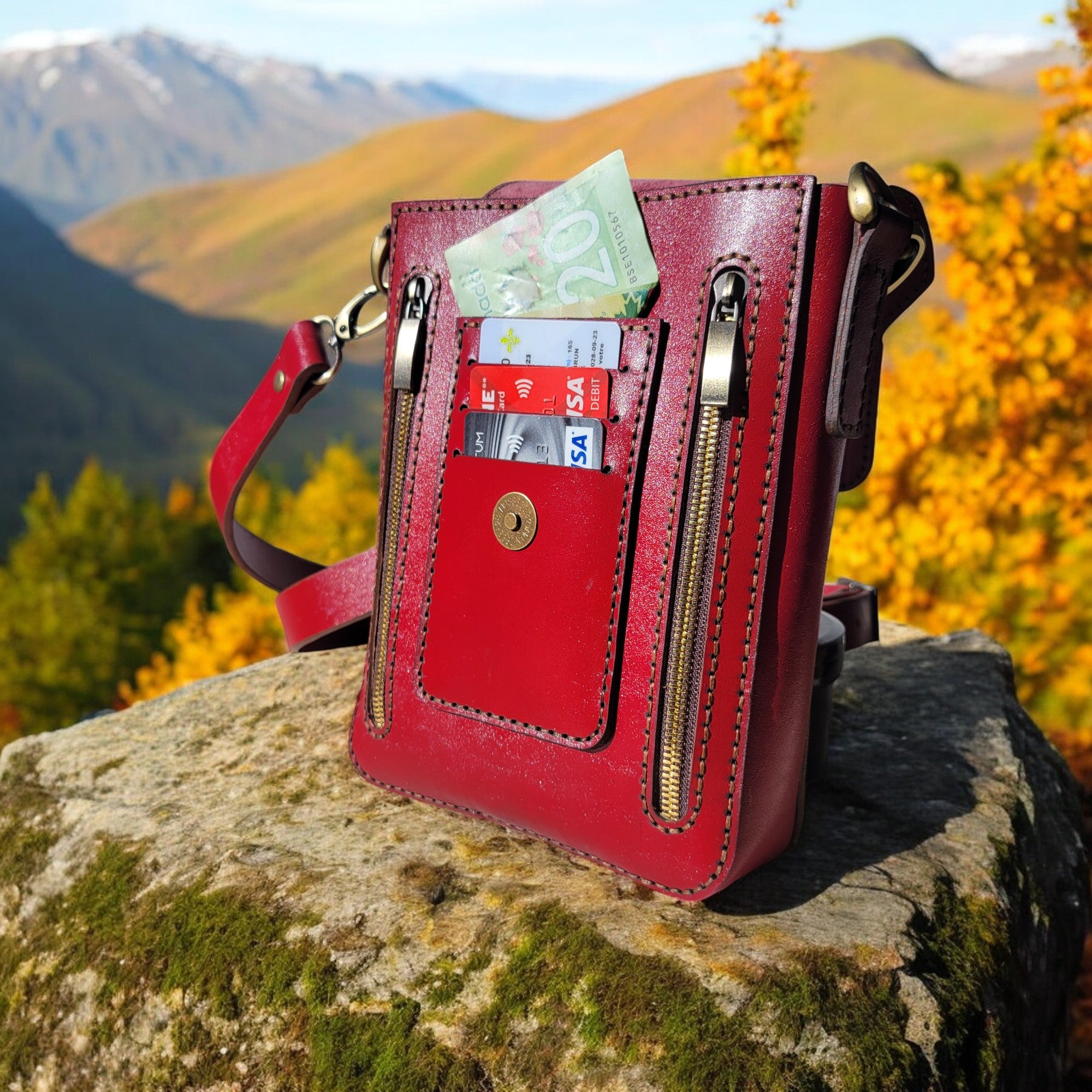 Handcrafted red leather bag designed for elegance and functionality, featuring multiple pockets for better organization – HagorArts Canada.