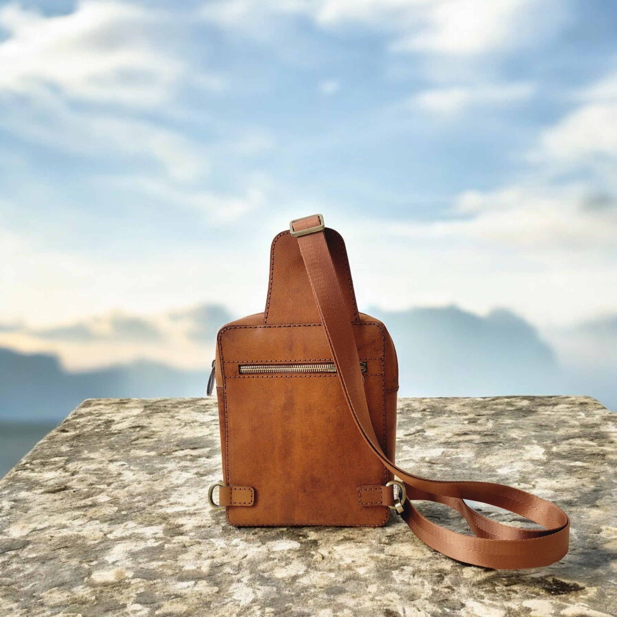 Panel-built construction with hand-stitched seams and edge burnishing from our Montréal atelier.