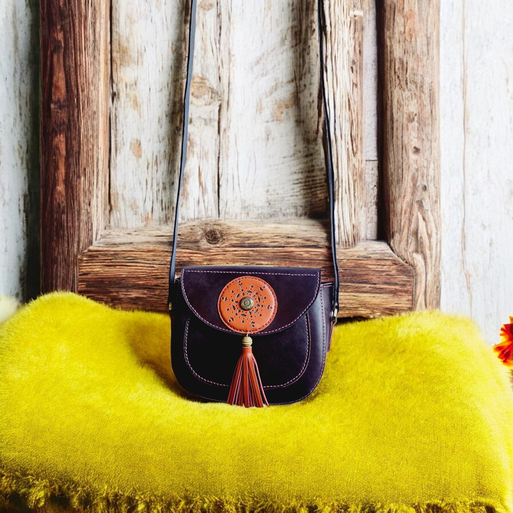 Close-up of eggplant flap bag with orange accent and stitched edges, HagorArts Elegant Carry C1.