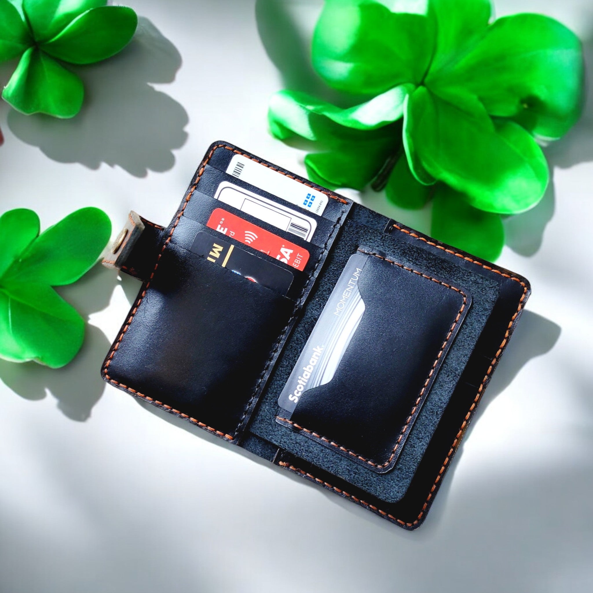 Closed view of the Prestige Collection C1 black leather cardholder with elegant stitching.
