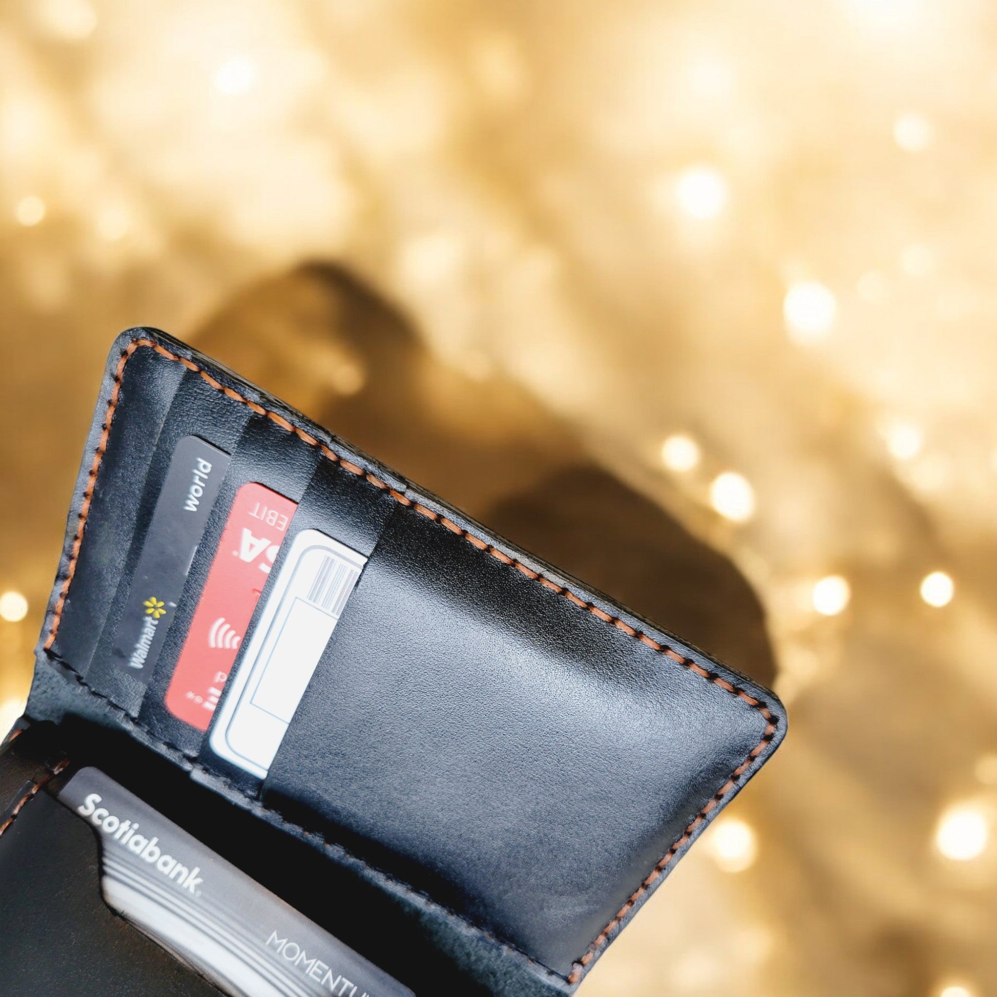 Compact black leather wallet with a sleek and professional look.