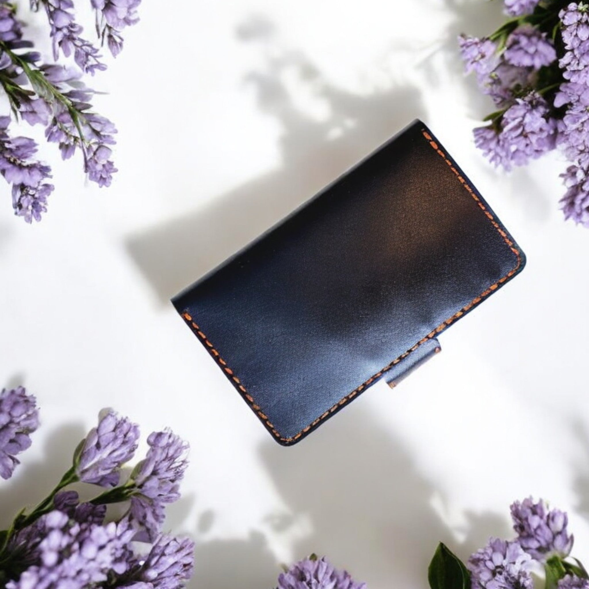 Side angle of Prestige Collection C1 leather cardholder showing precise hand-stitching.